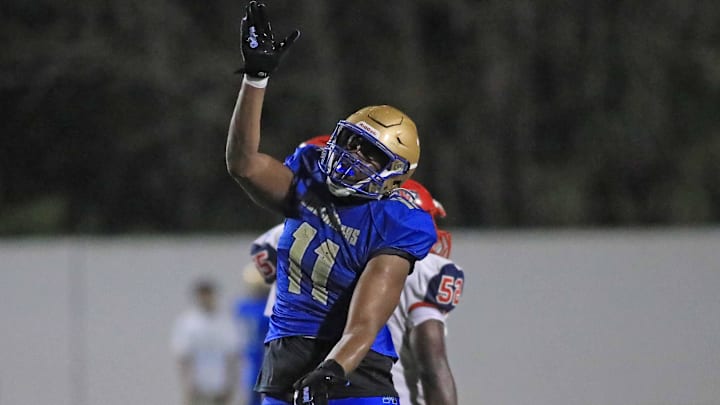 Mainland   s LJ Mccray (11) celebrates a sack during Friday night   s game against Vanguard.