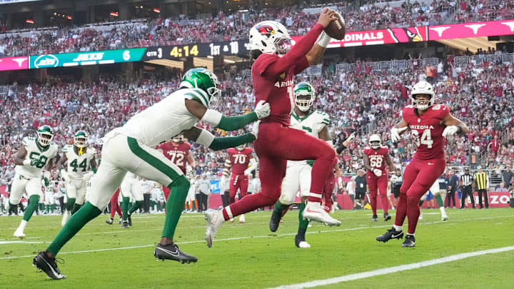 Arizona Cardinals quarterback Kyler Murray (1) runs for a touchdown ahead of New York Jets cornerback Sauce Gardner (1) during the third quarter at State Farm Stadium. Arizona Cardinals quarterback Kyler Murray (1) runs for a touchdown ahead of New York Jets cornerback Sauce Gardner (1) during the third quarter at State Farm Stadium.