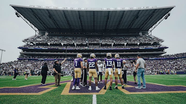 Husky captains Will Rogers, Cam Davis, Kam Fabiculanan and Alphonzo Tuputala meet for the coin toss. Husky captains Will Rogers, Cam Davis, Kam Fabiculanan and Alphonzo Tuputala meet for the coin toss.