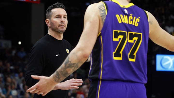 Mar 29, 2025; Memphis, Tennessee, USA; Los Angeles Lakers head coach JJ Redick talks with Los Angeles Lakers guard Luka Doncic (77) during the fourth quarter against the Memphis Grizzlies at FedExForum. Mandatory Credit: Petre Thomas-Imagn Images Mar 29, 2025; Memphis, Tennessee, USA; Los Angeles Lakers head coach JJ Redick talks with Los Angeles Lakers guard Luka Doncic (77) during the fourth quarter against the Memphis Grizzlies at FedExForum. Mandatory Credit: Petre Thomas-Imagn Images