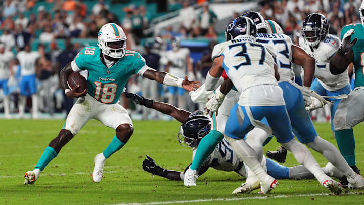 Miami Dolphins quarterback Tyler Huntley (18) runs with the ball during the second half against the Tennessee Titans at Hard Rock Stadium.