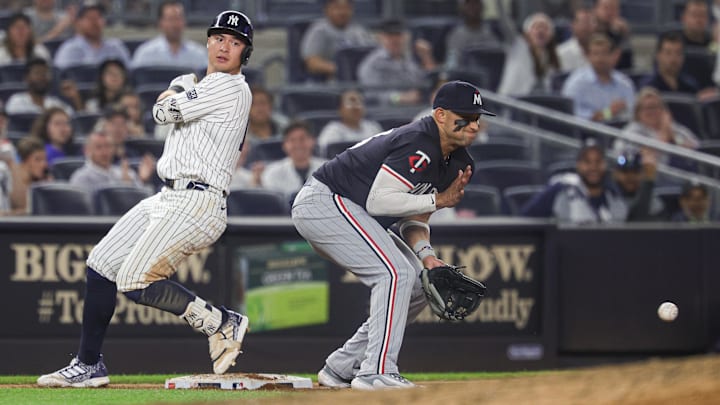 Jun 5, 2024; Bronx, New York, USA; New York Yankees shortstop Anthony Volpe (11) safely reaches third base on a triple as Minnesota Twins third baseman Royce Lewis (23) attempts to catch the ball during the eighth inning at Yankee Stadium. Jun 5, 2024; Bronx, New York, USA; New York Yankees shortstop Anthony Volpe (11) safely reaches third base on a triple as Minnesota Twins third baseman Royce Lewis (23) attempts to catch the ball during the eighth inning at Yankee Stadium.