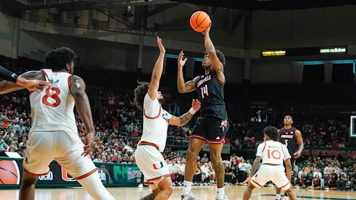Mar 7, 2026; Coral Gables, Florida, USA; Louisville Cardinals guard Adrian Wooley (14) shoots the ball against the Miami Hurricanes at Watsco Center. Mandatory Credit: Jeff Romance-Imagn Images