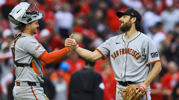 Mar 27, 2025; Cincinnati, Ohio, USA; San Francisco Giants relief pitcher Ryan Walker (74) shakes hands with catcher Patrick Bailey (14) after the victory over the Cincinnati Reds at Great American Ball Park.