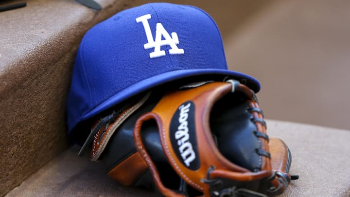 Aug 16, 2019; Atlanta, GA, USA; Detailed view of Los Angeles Dodgers hat and glove in the dugout against the Atlanta Braves in the first inning at SunTrust Park.