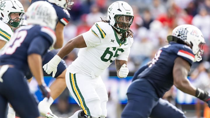 Nov 22, 2025; Tucson, Arizona, USA; Baylor Bears offensive lineman Sean Thompkins (65) against the Arizona Wildcats at Casino Del Sol Stadium. Mandatory Credit: Mark J. Rebilas-Imagn Images