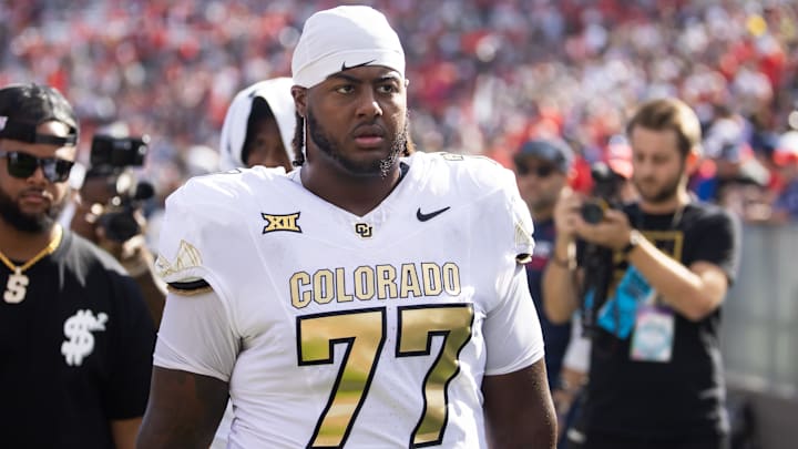 Oct 19, 2024; Tucson, Arizona, USA; Colorado Buffalos offensive tackle Jordan Seaton (77) against the Arizona Wildcats at Arizona Stadium. Mandatory Credit: Mark J. Rebilas-Imagn Images