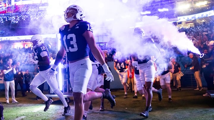 Penn State Nittany Lions linebacker Tony Rojas (13) runs out of the tunnel before the 2024 Fiesta Bowl against the Boise State Broncos.
