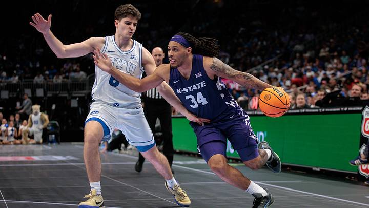 Mar 10, 2026; Kansas City, MO, USA; Kansas State Wildcats guard Nate Johnson (34) drives to the basket around BYU Cougars guard Aleksej Kostic (6) during the second half at T-Mobile Center. Mandatory Credit: William Purnell-Imagn Images Mar 10, 2026; Kansas City, MO, USA; Kansas State Wildcats guard Nate Johnson (34) drives to the basket around BYU Cougars guard Aleksej Kostic (6) during the second half at T-Mobile Center. Mandatory Credit: William Purnell-Imagn Images