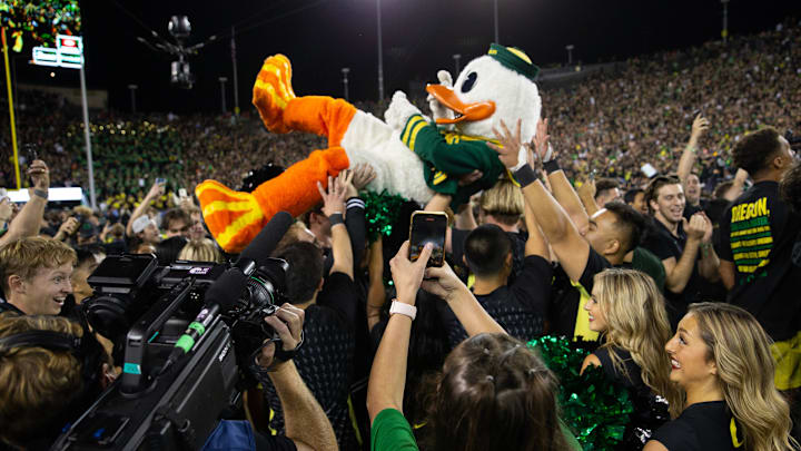 The Oregon Duck surfs the crowd after the football team defeated Ohio State at Autzen Stadium Saturday, Oct. 12, 2024.