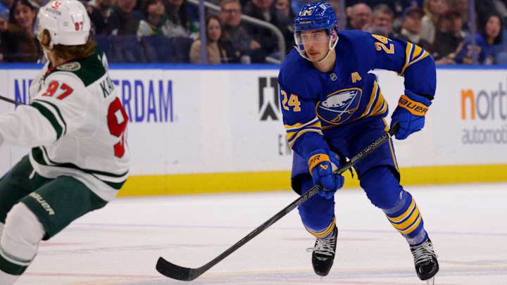 Nov 27, 2024; Buffalo, New York, USA;  Buffalo Sabres center Dylan Cozens (24) skates up ice with the puck during the second period against the Minnesota Wild at KeyBank Center. Mandatory Credit: Timothy T. Ludwig-Imagn Images
