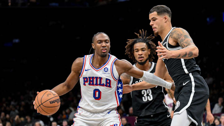 Nov 2, 2025; Brooklyn, New York, USA; Philadelphia 76ers guard Tyrese Maxey (0) sets the play while defended by Brooklyn Nets forward Michael Porter Jr. (17) and center Nic Claxton (33) during the first half at Barclays Center. Mandatory Credit: John Jones-Imagn Images Nov 2, 2025; Brooklyn, New York, USA; Philadelphia 76ers guard Tyrese Maxey (0) sets the play while defended by Brooklyn Nets forward Michael Porter Jr. (17) and center Nic Claxton (33) during the first half at Barclays Center. Mandatory Credit: John Jones-Imagn Images