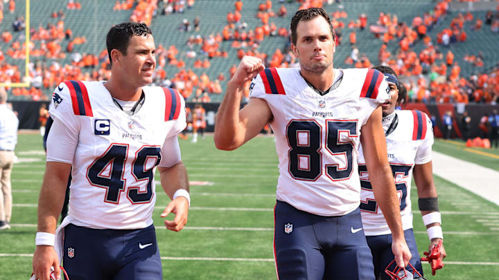Sep 8, 2024; Cincinnati, Ohio, USA; New England Patriots tight end Hunter Henry (85) and long snapper Joe Cardona (49) celebrate following the win over the Cincinnati Bengals at Paycor Stadium. Mandatory Credit: Joseph Maiorana-Imagn Images