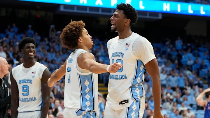 Nov 15, 2024; Chapel Hill, North Carolina, USA; North Carolina Tar Heels forward Jalen Washington (13) celebrates with guard Seth Trimble (7) in the second half at Dean E. Smith Center. Mandatory Credit: Bob Donnan-Imagn Images