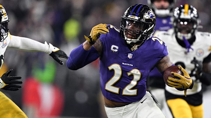 Jan 11, 2025; Baltimore, Maryland, USA; Baltimore Ravens running back Derrick Henry (22) runs against Pittsburgh Steelers linebacker Elandon Roberts (50) in the second quarter in an AFC wild card game at M&T Bank Stadium. Mandatory Credit: Tommy Gilligan-Imagn Images
