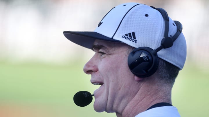 Louisville's coach Dan McDonnell talks to the broadcast in the game against Vanderbilt.