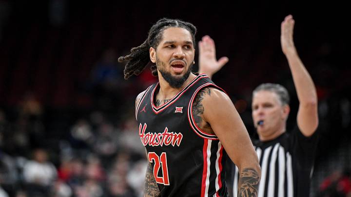 Dec 20, 2025; Newark, New Jersey, USA; Houston Cougars guard Emanuel Sharp (21) reacts after making a three point basket against the Arkansas Razorbacks during the second half at Prudential Center. Dec 20, 2025; Newark, New Jersey, USA; Houston Cougars guard Emanuel Sharp (21) reacts after making a three point basket against the Arkansas Razorbacks during the second half at Prudential Center.
