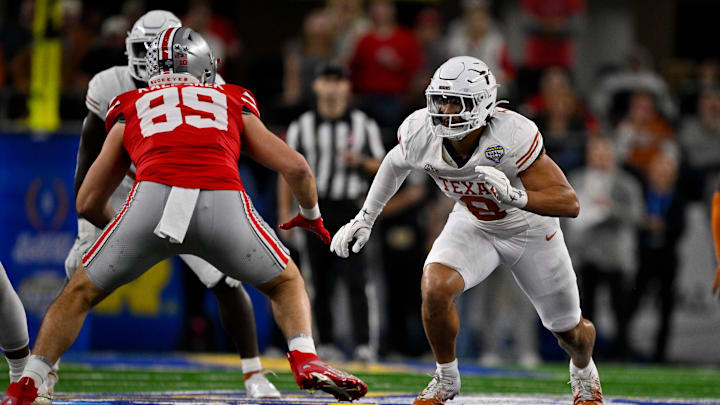 Texas Longhorns linebacker Trey Moore (8) and Ohio State Buckeyes tight end Will Kacmarek (89) in action during the game between the Texas Longhorns and the Ohio State Buckeyes at AT&T Stadium.