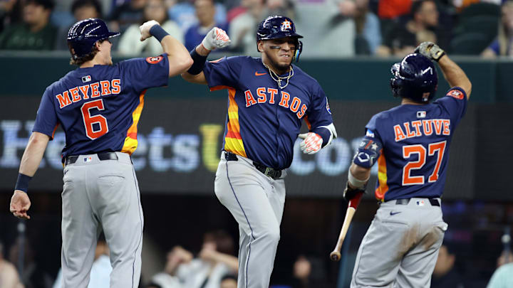 May 18, 2025; Arlington, Texas, USA; Houston Astros third base Isaac Paredes (15) is congratulated by outfielder Jake Meyers (6) and designated hitter Jose Altuve (27) after hitting a three run home run during the eighth inning against the Texas Rangers at Globe Life Field. Mandatory Credit: Tim Heitman-Imagn Images