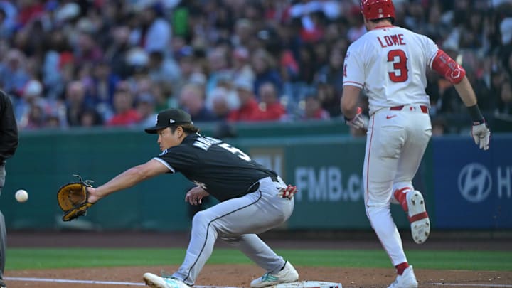 May 4, 2026; Anaheim, California, USA;  Chicago White Sox first baseman Munetaka Murakami (5) takes the throw as Los Angeles Angels left fielder Josh Lowe (3) is out at first in the second inning at Angel Stadium. Mandatory Credit: Jayne Kamin-Oncea-Imagn Images