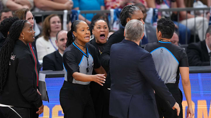 Apr 3, 2026; Phoenix, AZ, USA; UConn Huskies head coach Geno Auriemma and South Carolina Gamecocks head coach Dawn Staley react in the second half during a semifinal of the Final Four of the women's 2026 NCAA Tournament at Mortgage Matchup Center. Mandatory Credit: Joe Camporeale-Imagn Images