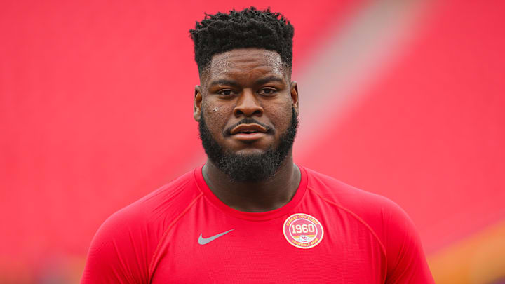 Aug 22, 2024; Kansas City, Missouri, USA; Kansas City Chiefs guard Trey Smith (65) warms up prior to a game against the Chicago Bears at GEHA Field at Arrowhead Stadium. Mandatory Credit: Jay Biggerstaff-Imagn Images
