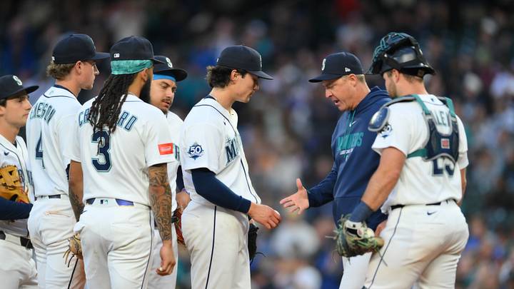 Jun 30, 2026; Seattle, Washington, USA; Seattle Mariners manager Dan Wilson (6) pulls starting pitcher Bryan Woo (22) from the game during the seventh inning at T-Mobile Park. Mandatory Credit: Steven Bisig-Imagn Images Jun 30, 2026; Seattle, Washington, USA; Seattle Mariners manager Dan Wilson (6) pulls starting pitcher Bryan Woo (22) from the game during the seventh inning at T-Mobile Park. Mandatory Credit: Steven Bisig-Imagn Images