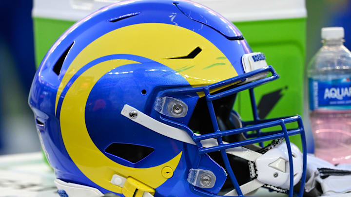 Nov 17, 2024; Foxborough, Massachusetts, USA; A Los Angeles Rams helmet sits on a cooler during the second half against the New England Patriots at Gillette Stadium. Mandatory Credit: Eric Canha-Imagn Images