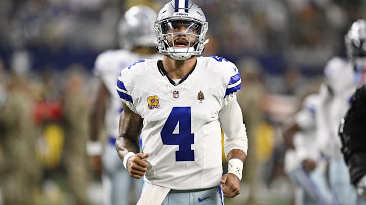 Sep 28, 2025; Arlington, Texas, USA; Dallas Cowboys quarterback Dak Prescott (4) looks on before the game against the Green Bay Packers at AT&T Stadium. Mandatory Credit: Jerome Miron-Imagn Images