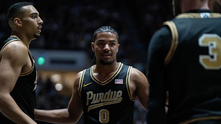 Purdue Boilermakers guard C.J. Cox (0) huddles with his teammates.