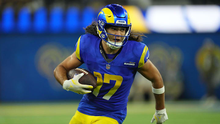 Los Angeles Rams wide receiver Puka Nacua (17) carries the ball against the Miami Dolphins at SoFi Stadium. 