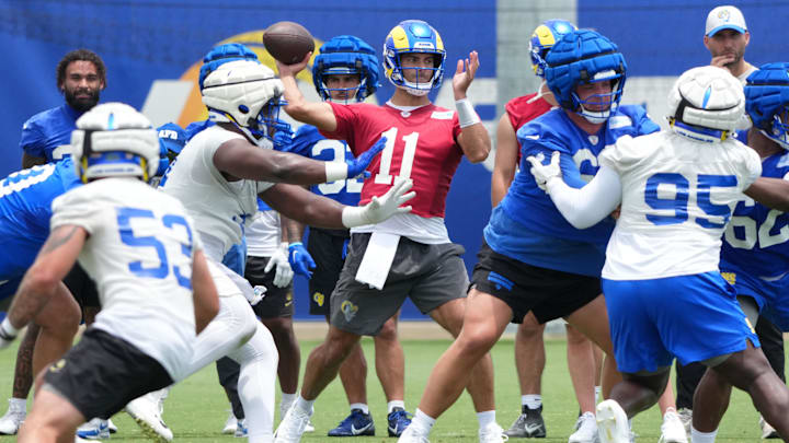Jun 3, 2025; Woodland Hills, CA, USA; Los Angeles Rams quarterback Jimmy Garoppolo (11) throws the ball during organized team activities at Rams Practice Facility. Mandatory Credit: Kirby Lee-Imagn Images