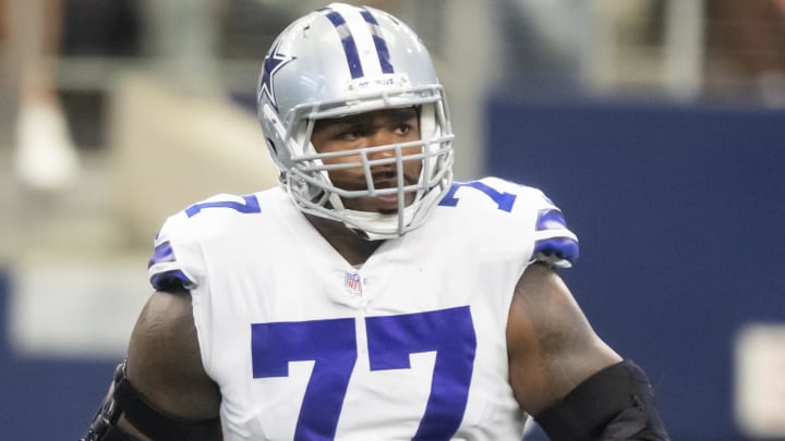 Oct 3, 2021; Arlington, Texas, USA; Dallas Cowboys offensive tackle Tyron Smith (77) against the Carolina Panthers at AT&T Stadium. Mandatory Credit: Mark J. Rebilas-USA TODAY Sports Oct 3, 2021; Arlington, Texas, USA; Dallas Cowboys offensive tackle Tyron Smith (77) against the Carolina Panthers at AT&T Stadium. Mandatory Credit: Mark J. Rebilas-USA TODAY Sports