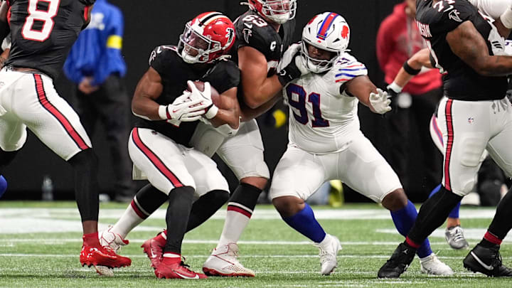 Oct 13, 2025; Atlanta, Georgia, USA; Atlanta Falcons running back Bijan Robinson (7) is tackled by. Buffalo Bills defensive tackle Ed Oliver (91) Oct 13, 2025; Atlanta, Georgia, USA; Atlanta Falcons running back Bijan Robinson (7) is tackled by. Buffalo Bills defensive tackle Ed Oliver (91)