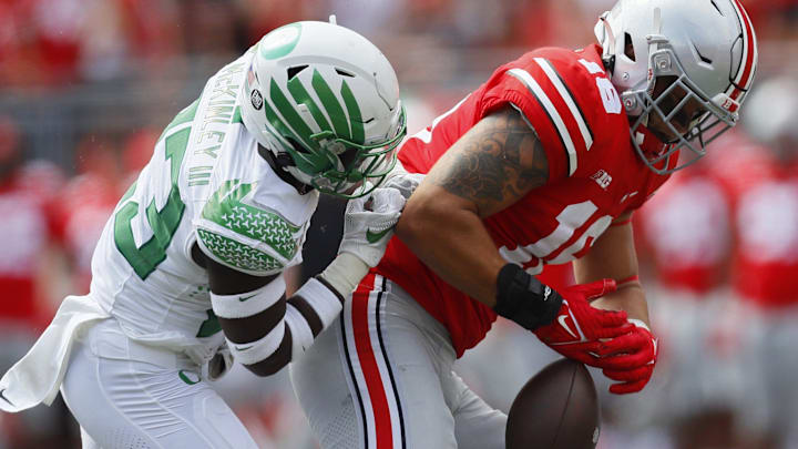 Ohio State Buckeyes tight end Cade Stover (16) gets the ball knocked away from him by Oregon Ducks cornerback Verone McKinley III (23).