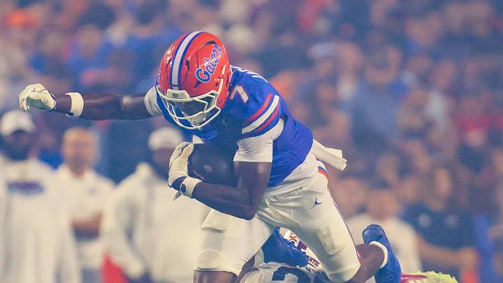 Florida tight end Amir Jackson (7) runs through the smoke of fireworks during the second half an NCAA football game at Steve Spurrier Field at Ben Hill Griffin Stadium in Gainesville, FL on Saturday, September 5, 2026. [Alan Youngblood/Gainesville Sun]