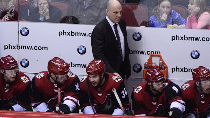 Feb 10, 2018; Glendale, AZ, USA; Arizona Coyotes head coach Rick Tocchet looks on during the second period against the Philadelphia Flyers at Gila River Arena. Mandatory Credit: Matt Kartozian-Imagn Images