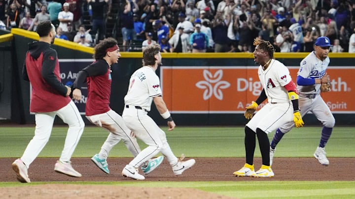 Arizona Diamondbacks Geraldo Perdomo (2) celebrates after hitting the game winning RBI-single to defeat the Los Angeles Dodgers 5-4 in the ninth inning at Chase Field in Phoenix on Sept. 23, 2025. Mandatory Credit: Rob Schumacher-Arizona Republic