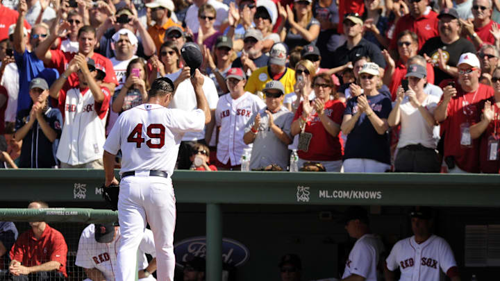 July 24, 2011; Boston, MA, USA; Boston Red Sox starting pitcher Tim Wakefield (49) tips his hat to