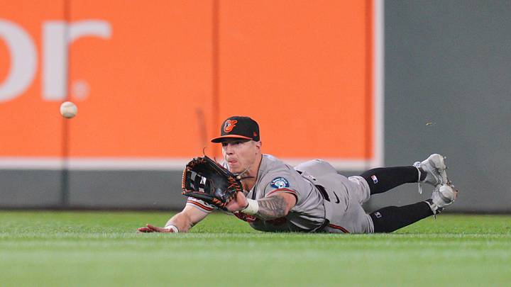 Aug 11, 2026; Minneapolis, Minnesota, USA; Baltimore Orioles right fielder Tyler O'Neill (9) makes a diving catch against the Minnesota Twins in the eighth inning at Target Field. Mandatory Credit: Brad Rempel-Imagn Images Aug 11, 2026; Minneapolis, Minnesota, USA; Baltimore Orioles right fielder Tyler O'Neill (9) makes a diving catch against the Minnesota Twins in the eighth inning at Target Field. Mandatory Credit: Brad Rempel-Imagn Images