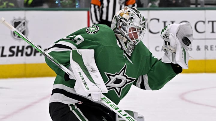Jan 24, 2025; Dallas, Texas, USA; Dallas Stars goaltender Jake Oettinger (29) makes a glove save against the Vegas Golden Knights during the third period at the American Airlines Center. Mandatory Credit: Jerome Miron-Imagn Images