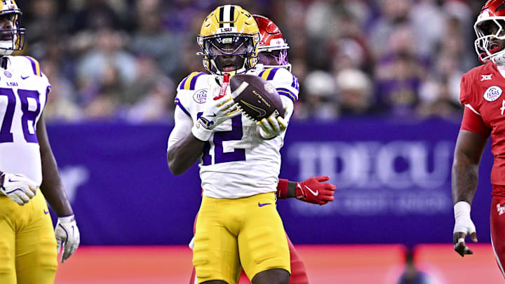 Dec 27, 2025; Houston, TX, USA; Louisiana State Tigers wide receiver Kyle Parker (12) motions during the first half against the Houston Cougars at NRG Stadium. Mandatory Credit: Maria Lysaker-Imagn Images 