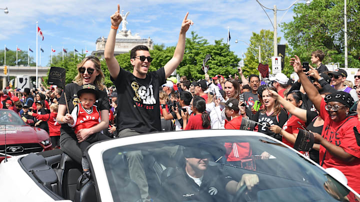 Jun 17, 2019; Toronto, Ontario, Canada; Toronto raptors general Manager Bobby Webster and his family celebrate with fans during the Toronto Raptors Championship Parade on Lakeshore Boulevard. Mandatory Credit: Gerry Angus-Imagn Images