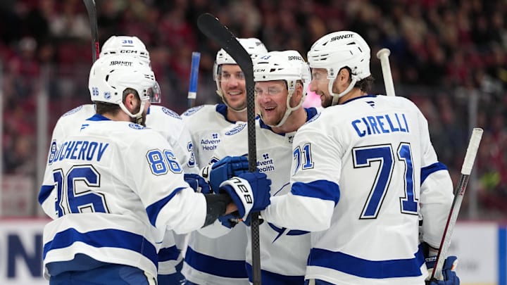 Dec 9, 2025; Montreal, Quebec, CAN; Tampa Bay Lightning defenseman Darren Raddysh (43) celebrates with teammates including forward Nikita Kucherov (86) and defenseman Max crozier (24) and forward Anthony Cirelli (71) after scoring a goal against the Montreal Canadiens during the third period at the Bell Centre. Mandatory Credit: Eric Bolte-Imagn Images