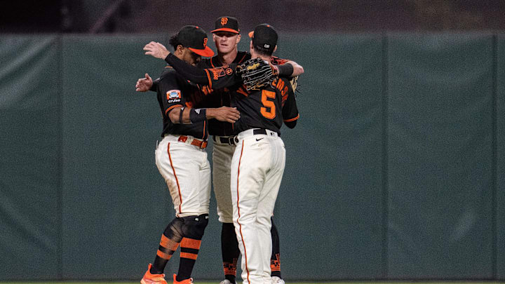 Sep 30, 2023; San Francisco, California, USA; San Francisco Giants center fielder Mike Yastrzemski (5) and San Francisco Giants center fielder Tyler Fitzgerald (49) and San Francisco Giants left fielder Heliot Ramos (12) celebrate after the game against the Los Angeles Dodgers at Oracle Park.