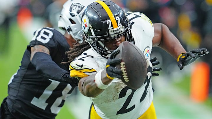 Oct 13, 2024; Paradise, Nevada, USA; Pittsburgh Steelers running back Najee Harris (22) is pushed out of bounds by Las Vegas Raiders cornerback Jack Jones (18) during the third quarter at Allegiant Stadium. Mandatory Credit: Stephen R. Sylvanie-Imagn Images