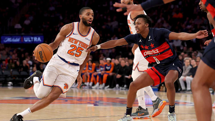 Nov 18, 2024; New York, New York, USA; New York Knicks forward Mikal Bridges (25) drives to the basket against Washington Wizards guard Carlton Carrington (8) during the third quarter at Madison Square Garden. Mandatory Credit: Brad Penner-Imagn Images