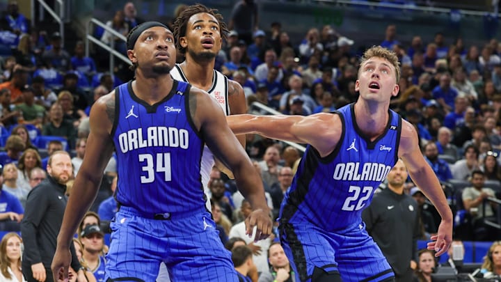 Oct 25, 2024; Orlando, Florida, USA; Orlando Magic center Wendell Carter Jr. (34), forward Franz Wagner (22) and Brooklyn Nets center Nic Claxton (33) watch for the rebound during the second quarter at Kia Center. Mandatory Credit: Mike Watters-Imagn Images