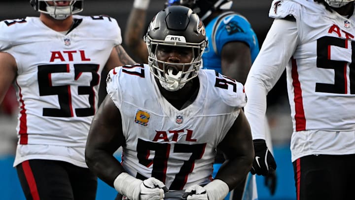 Oct 13, 2024; Charlotte, North Carolina, USA; Atlanta Falcons defensive end Grady Jarrett (97) celebrates making a tackle in the second quarter at Bank of America Stadium. Mandatory Credit: Bob Donnan-Imagn Images Oct 13, 2024; Charlotte, North Carolina, USA; Atlanta Falcons defensive end Grady Jarrett (97) celebrates making a tackle in the second quarter at Bank of America Stadium. Mandatory Credit: Bob Donnan-Imagn Images