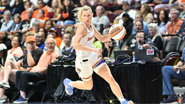 Jun 18, 2025; Uncasville, Connecticut, USA; Phoenix Mercury guard Lexi Held (1) dribbles the ball against the Connecticut Sun during the second half at Mohegan Sun Arena. Mandatory Credit: Eric Canha-Imagn Images